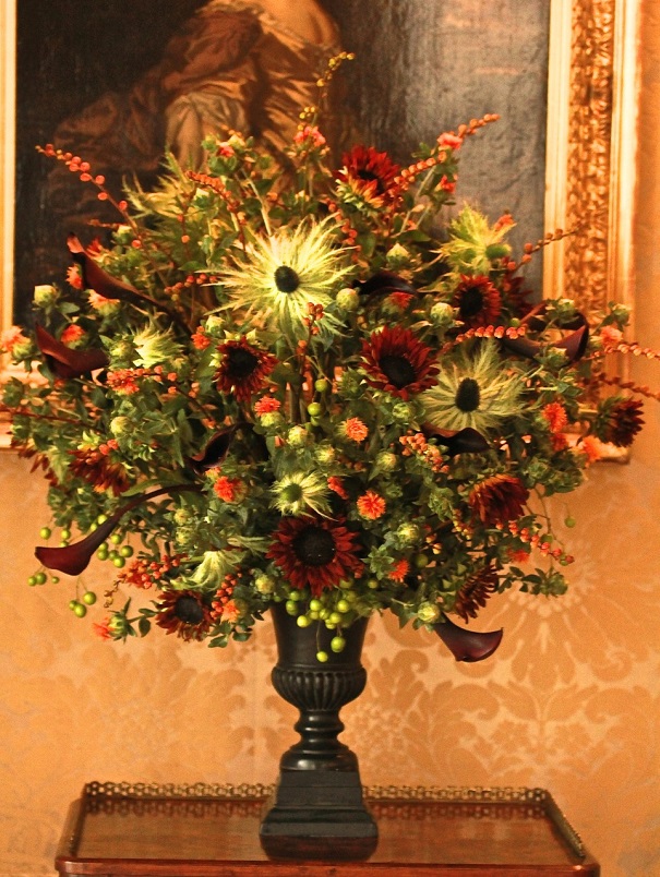 Brown sunflowers, thistles, black calla lilies