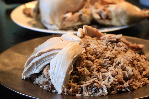 Lebanese Stuffed Rice and Chicken arranging the dish on Americas-Table.com