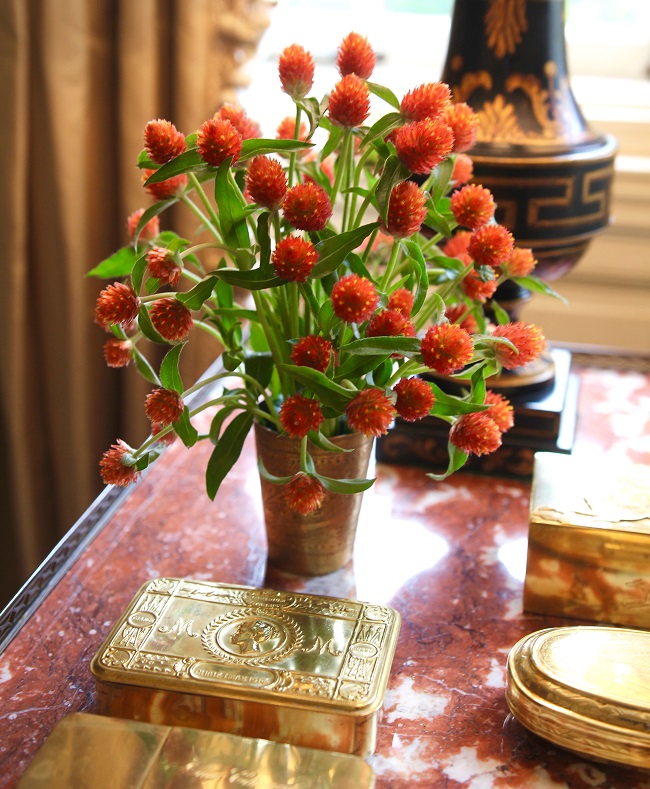 Orange Gomphrena in chased brass cup