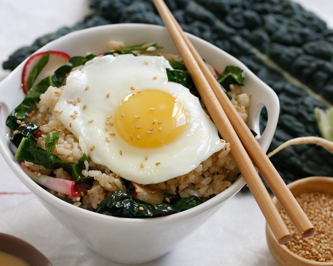 BROWN RICE BOWL WITH KALE-RADISH SLAW, SOY, AND FRIED EGG 