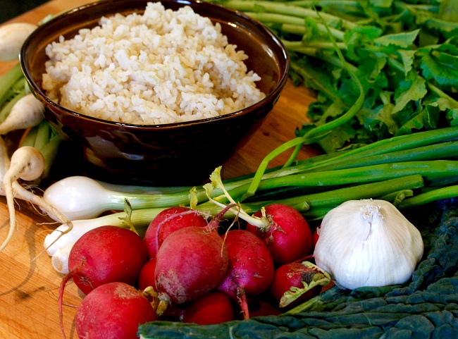 BROWN RICE BOWL WITH KALE-RADISH SLAW, SOY, AND FRIED EGG